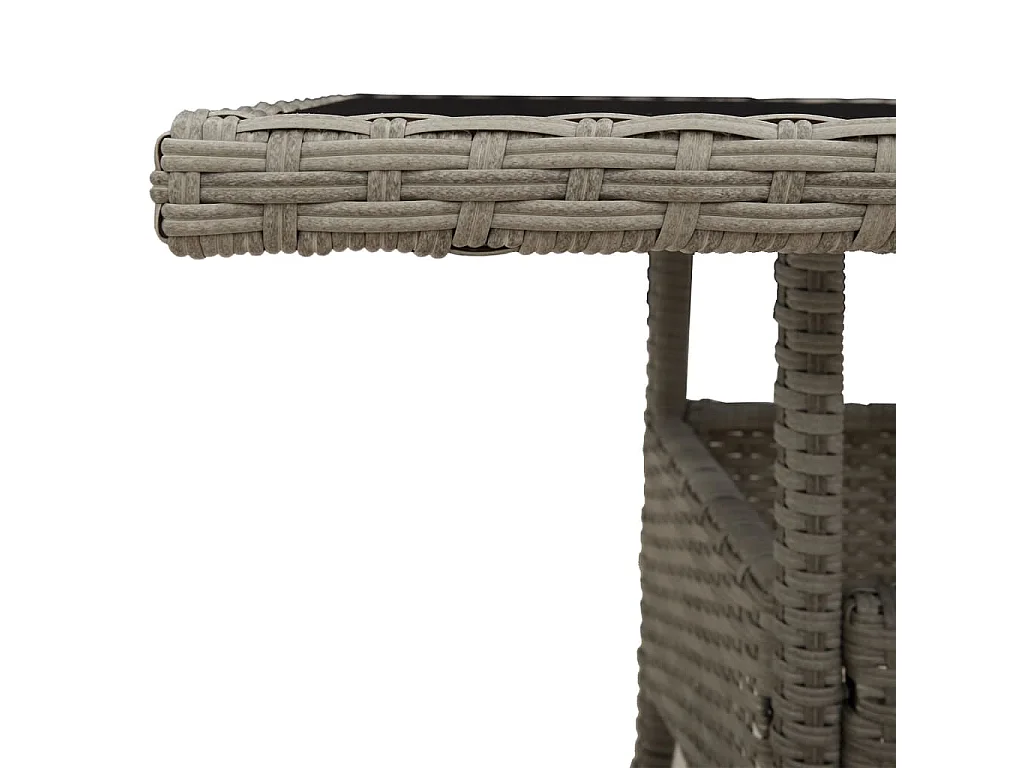 Mesa de jardín con tablero de cristal gris claro y resina trenzada.