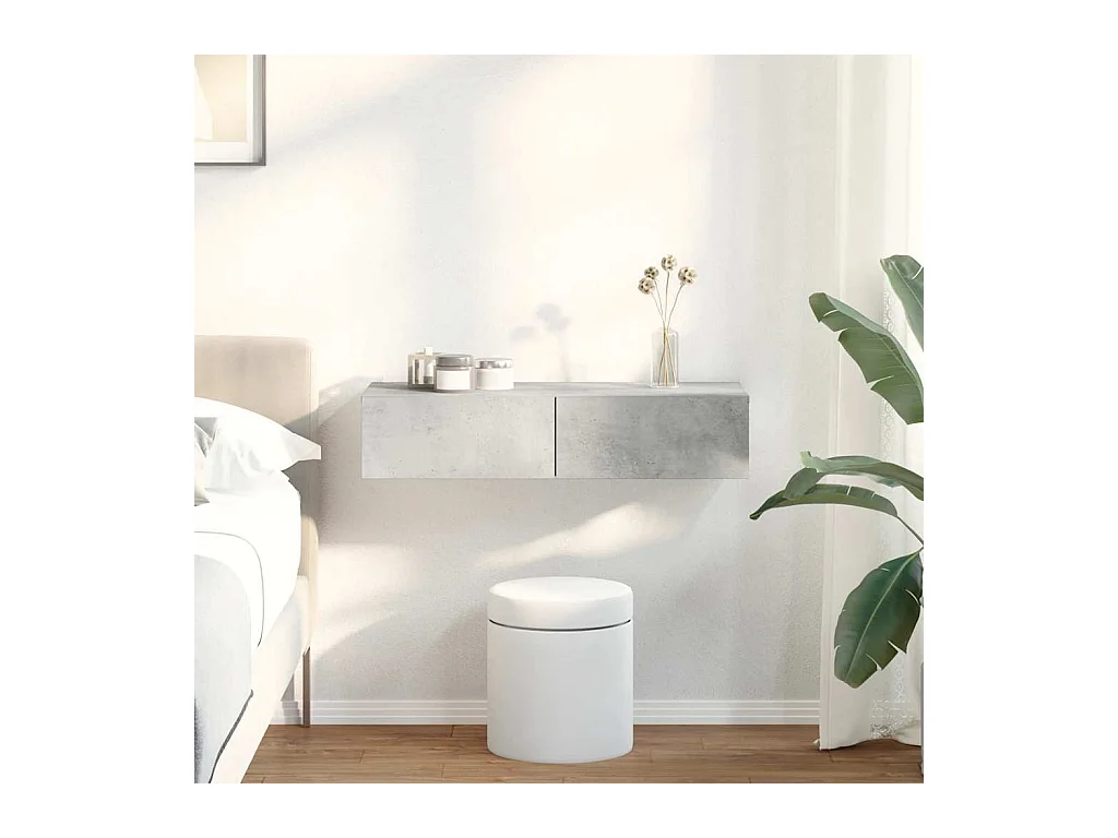 Betongrijze wandplank van bewerkt hout met lades