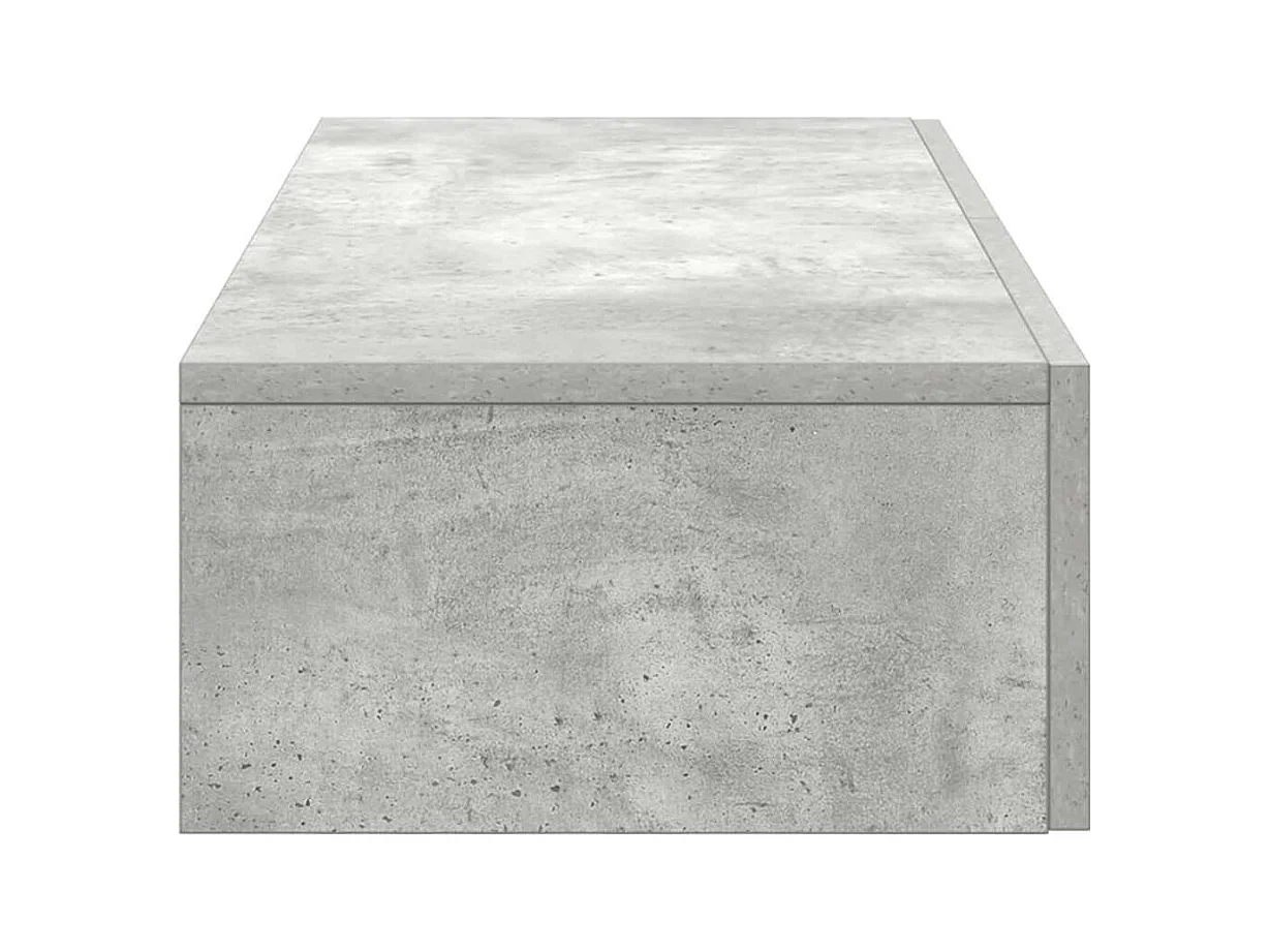 Betongrijze wandplank van bewerkt hout met lades