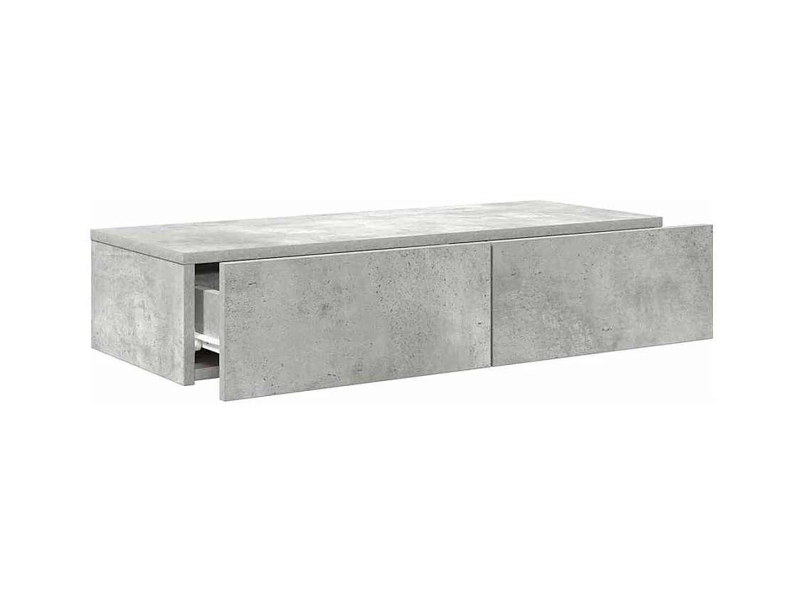 Betongrijze wandplank van bewerkt hout met lades