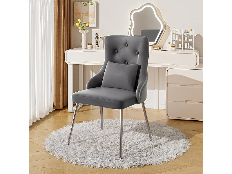 Silla de comedor de terciopelo gris con cojín lumbar y diseño moderno y patas de metal.