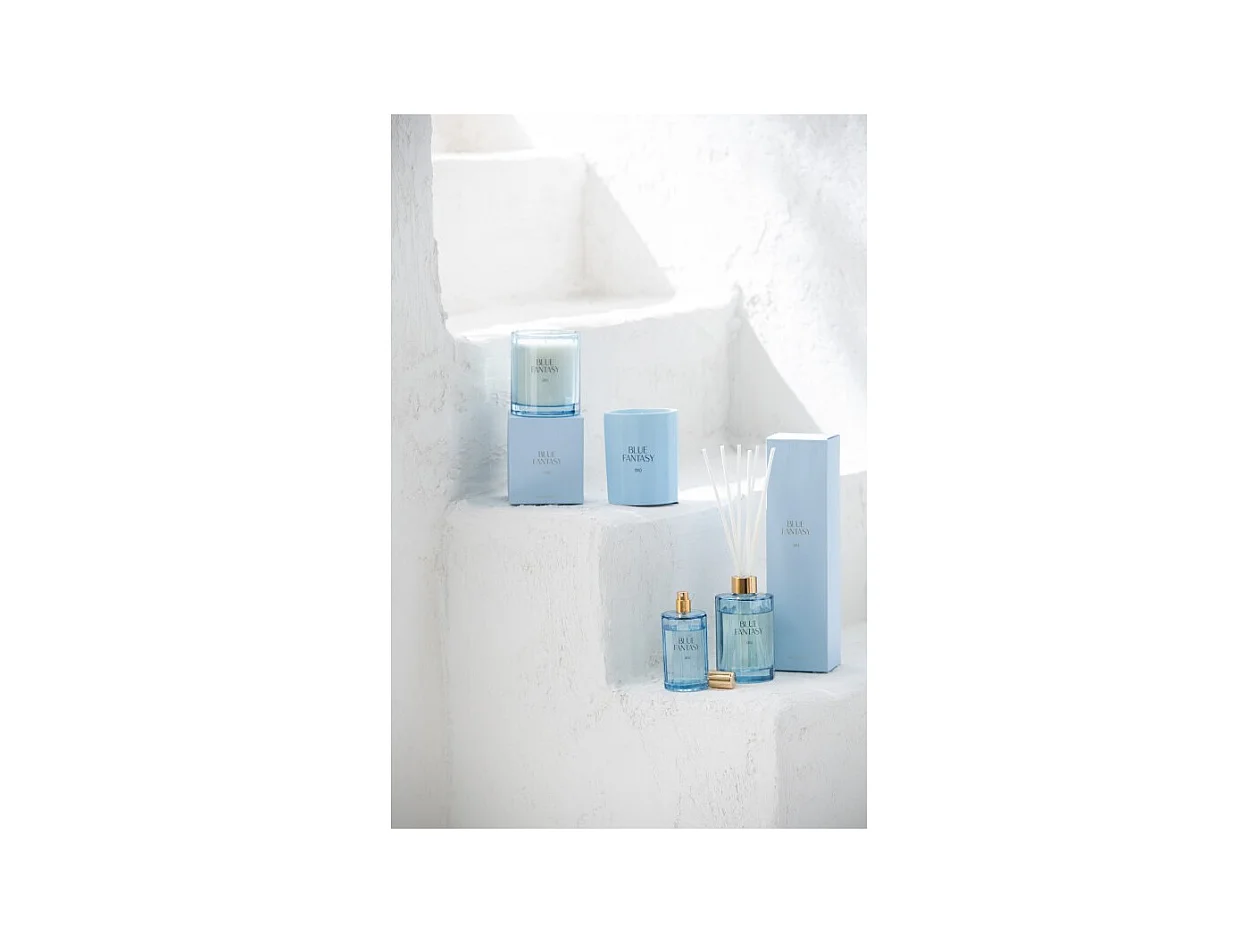 Vela perfumada 30H en vidrio azul 9x9x10.5 cm