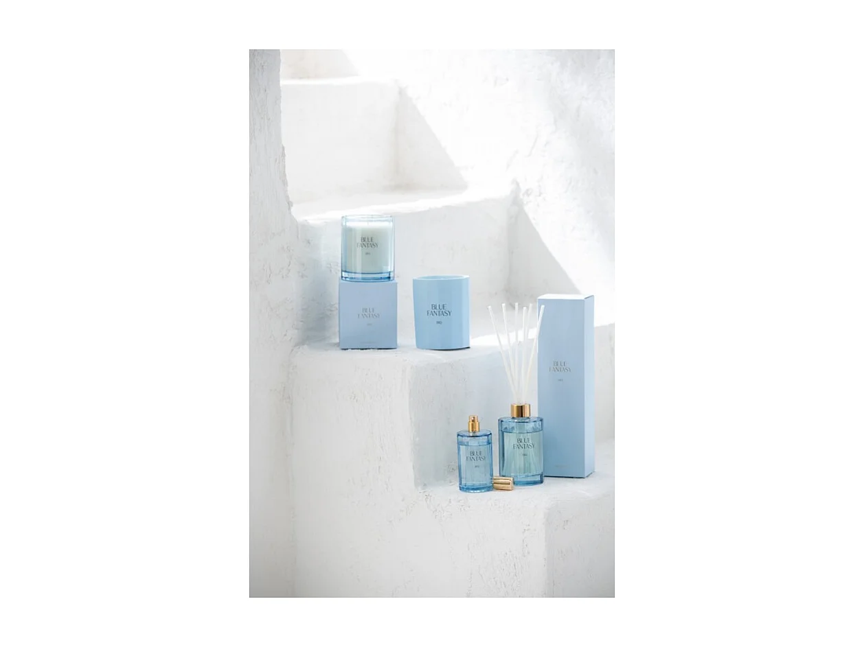 Vela perfumada 30H en vidrio azul 9x9x10.5 cm