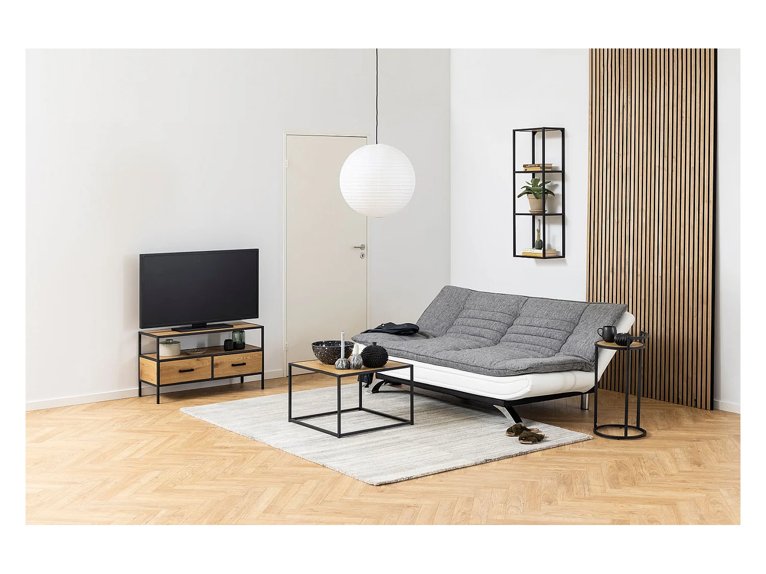 Fanny Schlafsofa in hellgrau und weissen Design.