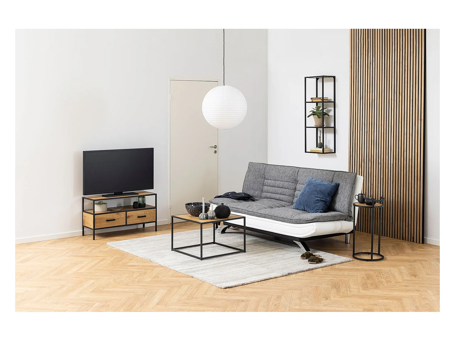 Fanny Schlafsofa in hellgrau und weissen Design.