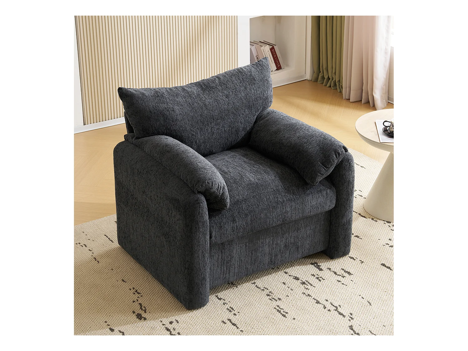 Fauteuil surdimensionné en chenille avec coussin. Confortable et moderne, idéal pour salon et chambre.