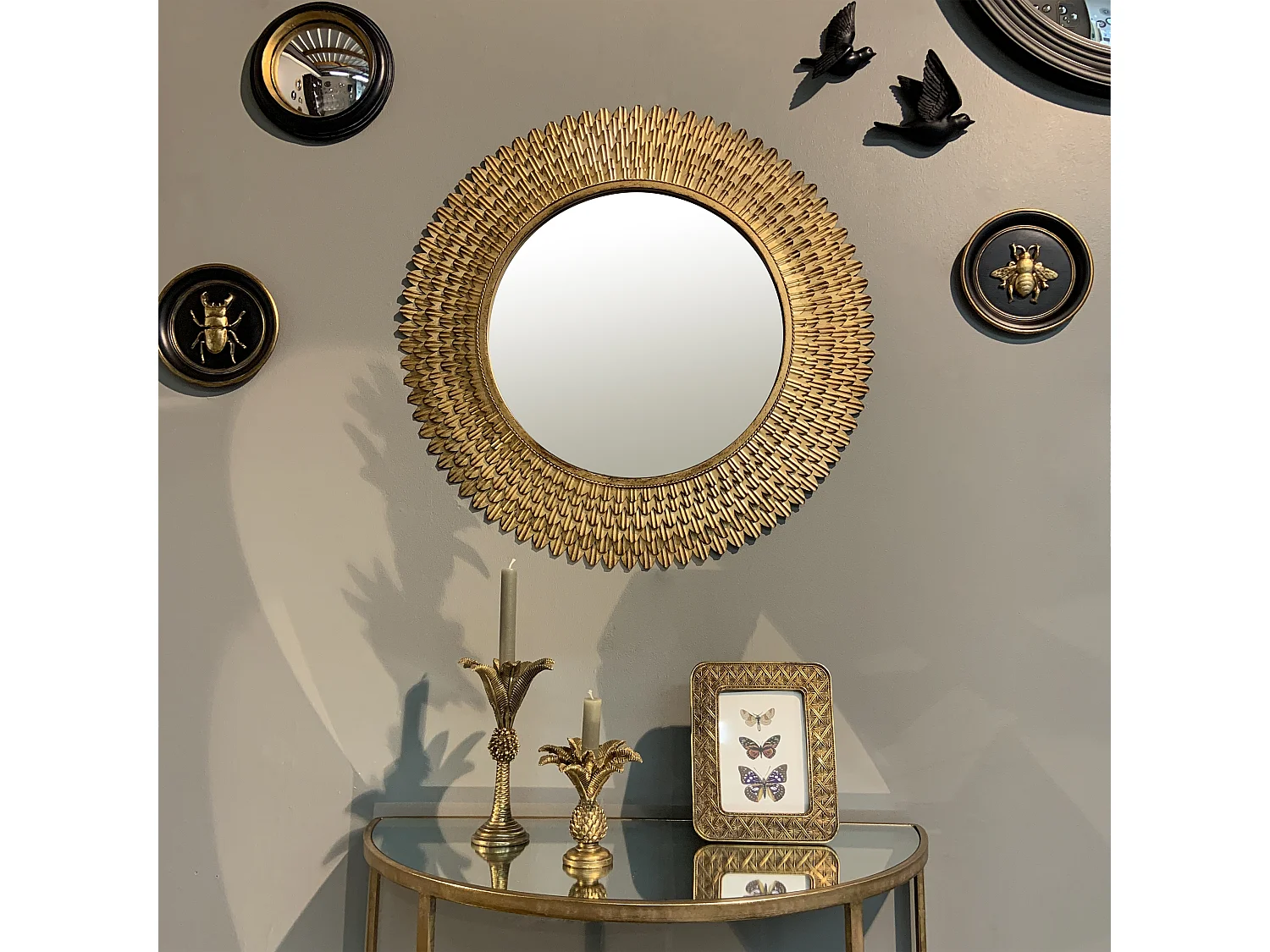 Miroir rond plumes métal doré patiné 76cm
