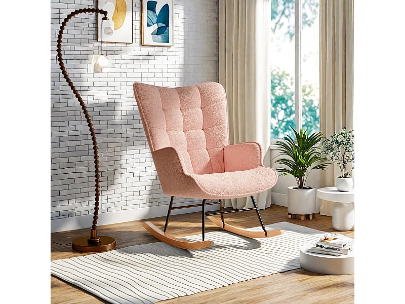 Fauteuil à bascule en tissu teddy rose avec dossier capitonné, design cosy et moderne pour salon ou chambre
