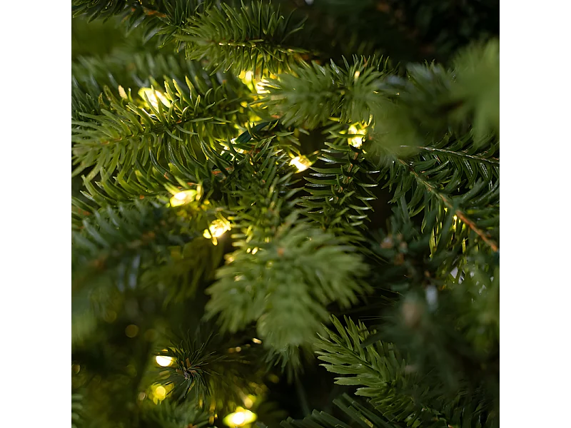 Sapin de Noël avec LED et tronc moderne "Italia" en PE avec effet Real Touch, hauteur 270 cm.