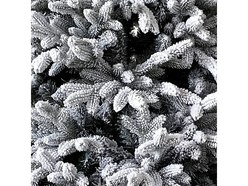 Smukła, nowoczesna choinka bożonarodzeniowa "Comet" pokryta śniegiem, wykonana z PE z efektem Real Touch + Flock, o wysokości 180 cm.