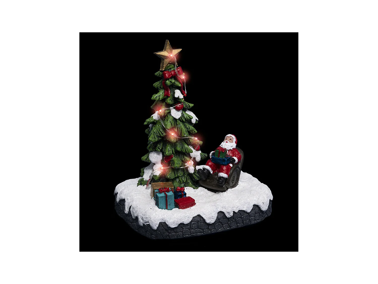 Village de Noël lumineux Père noël dans son fauteuil autour d'un sapin