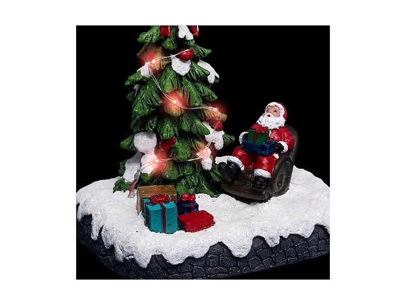 Village de Noël lumineux Père noël dans son fauteuil autour d'un sapin