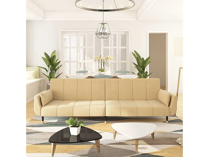 Sofá cama doble con dos almohadas de terciopelo color crema