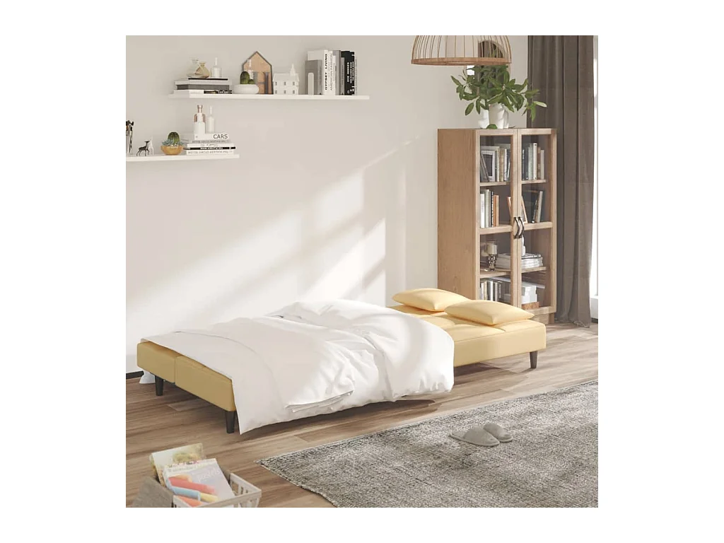 2-Sitzer-Schlafsofa mit zwei cremefarbenen Samtkissen