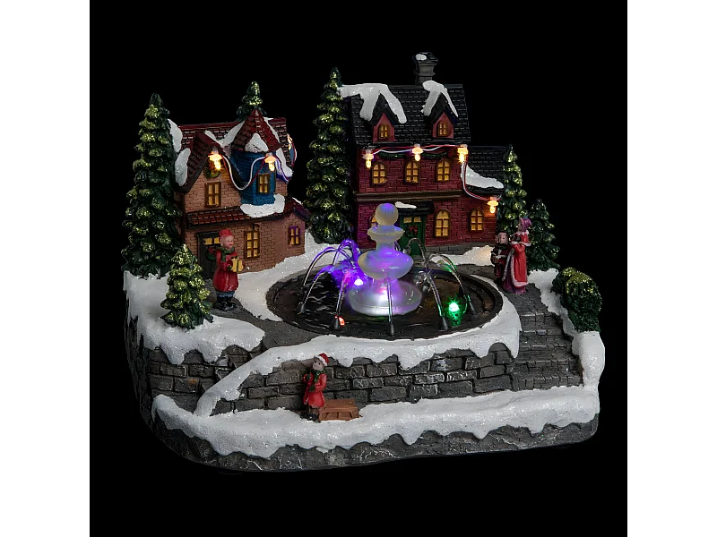 Village de Noël lumineux et mouvement d'eau Scène de vie autour d'une fontaine