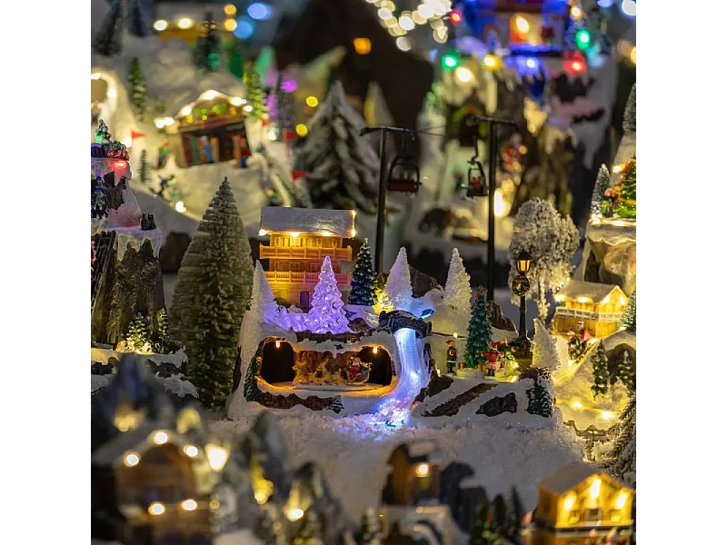 Village de Noël lumineux et animé Scène de vie autour du Chalet à la montagne