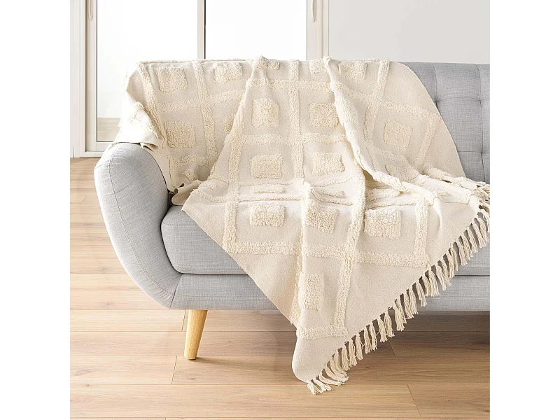 Manta tufted con borlas