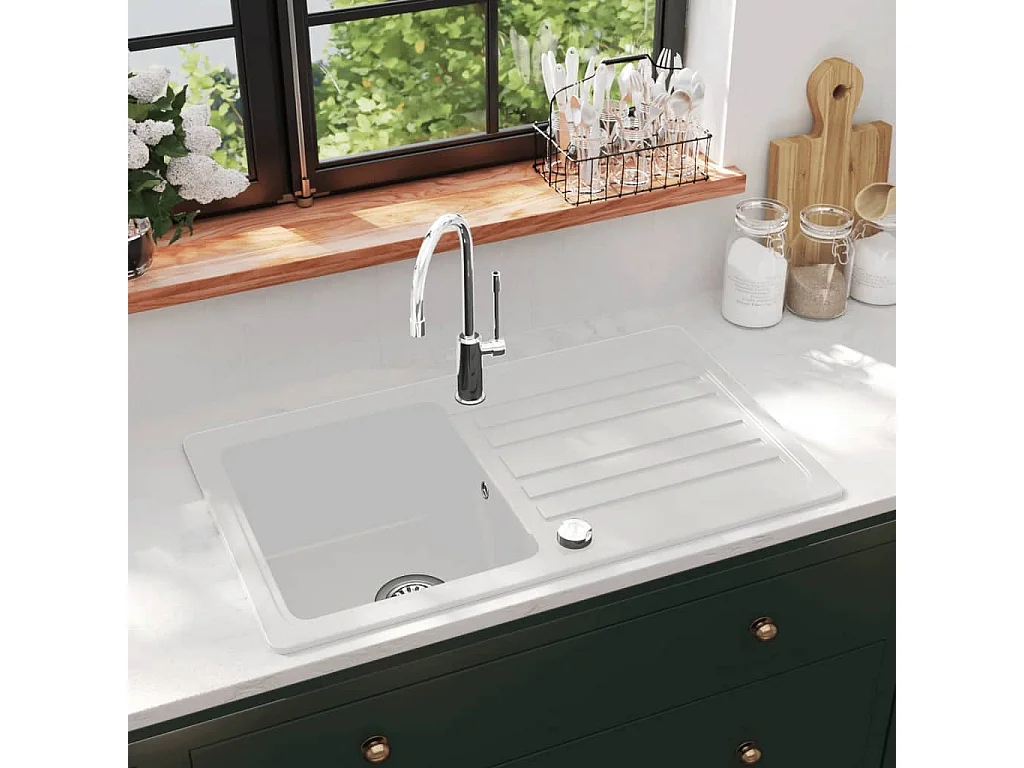 Crèmekleurige granieten spoelbak met enkele kom en afdruipvlak