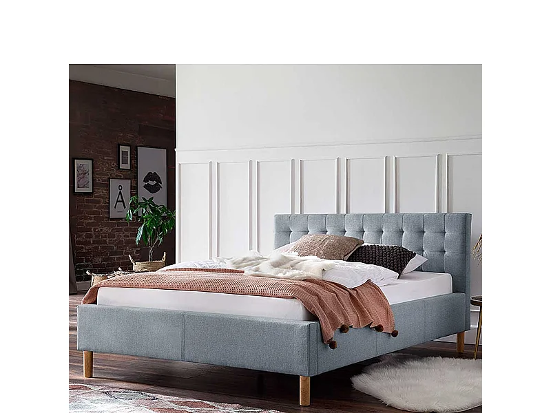 Stoffbett in Hellblau gestepptem Kopfteil