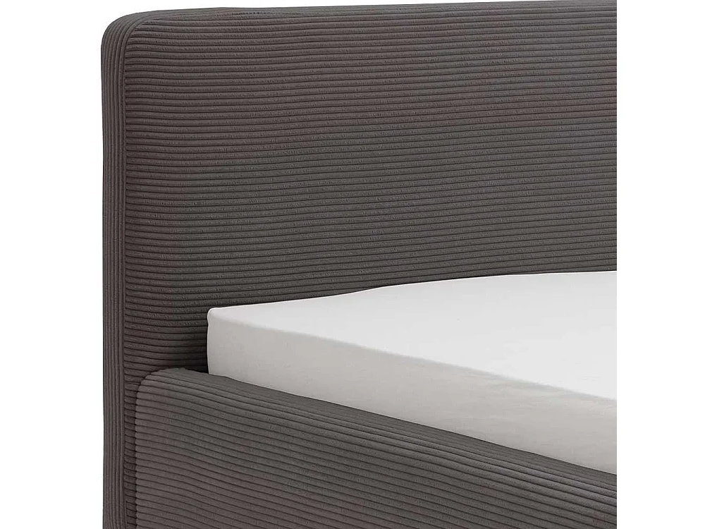 Graues Polsterbett mit Cord Bezug Vierfußgestell aus Holz