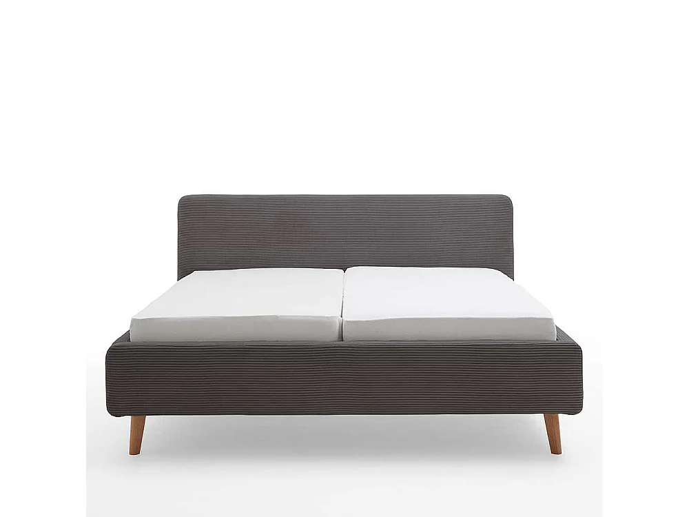 Graues Polsterbett mit Cord Bezug Vierfußgestell aus Holz