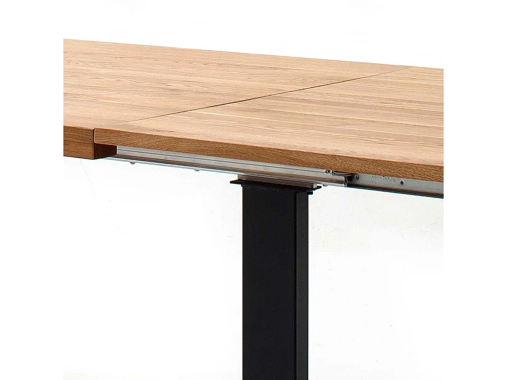 Ausziehtisch aus Wildeiche Massivholz Bügelgestell in Schwarz