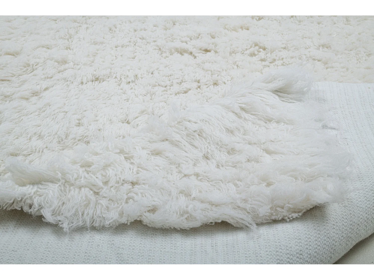 Tapis shaggy en laine naturelle tissé à la main  180x250 cm blanc Fluffy