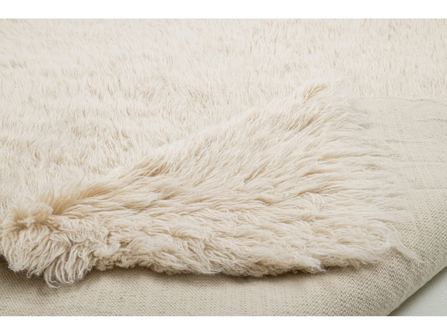 Tapis shaggy en laine naturelle tissé à la main  140x190 cm beige Fluffy