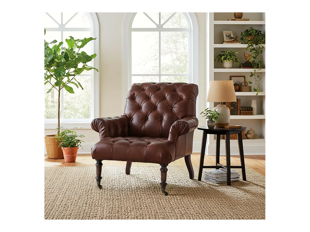 Fauteuil rembourré en cuir avec accoudoirs capitonnés