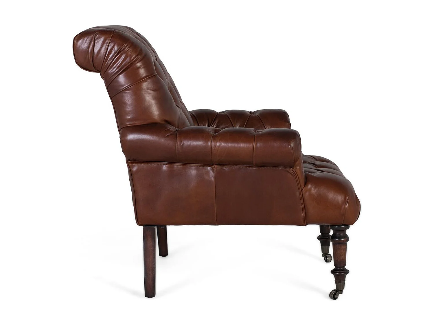 Sillón tapizado en cuero con reposabrazos acabado en capitoné