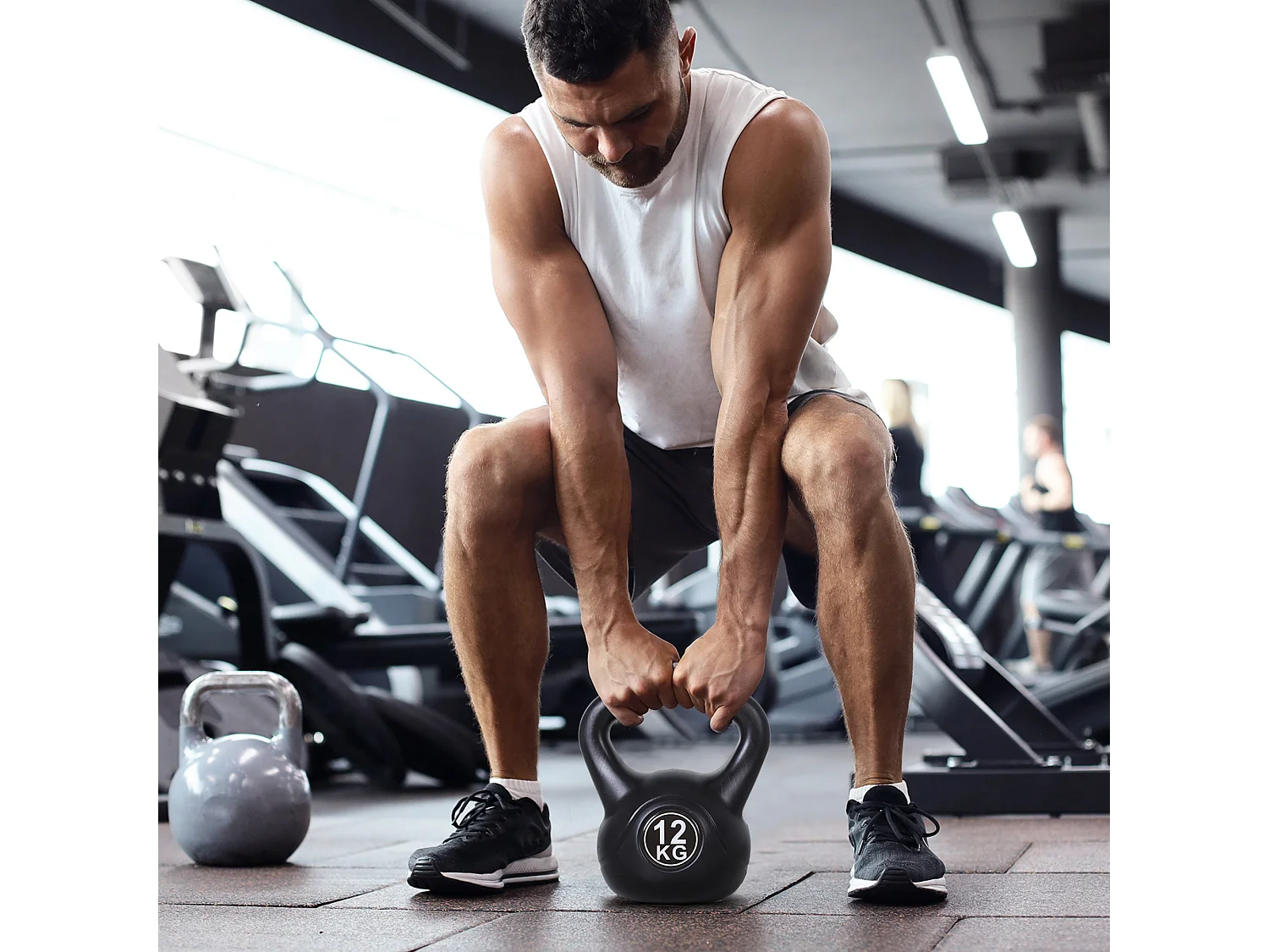 Kettlebell 12 Kg - haltère boule - poignée ergonomique - PVC noir