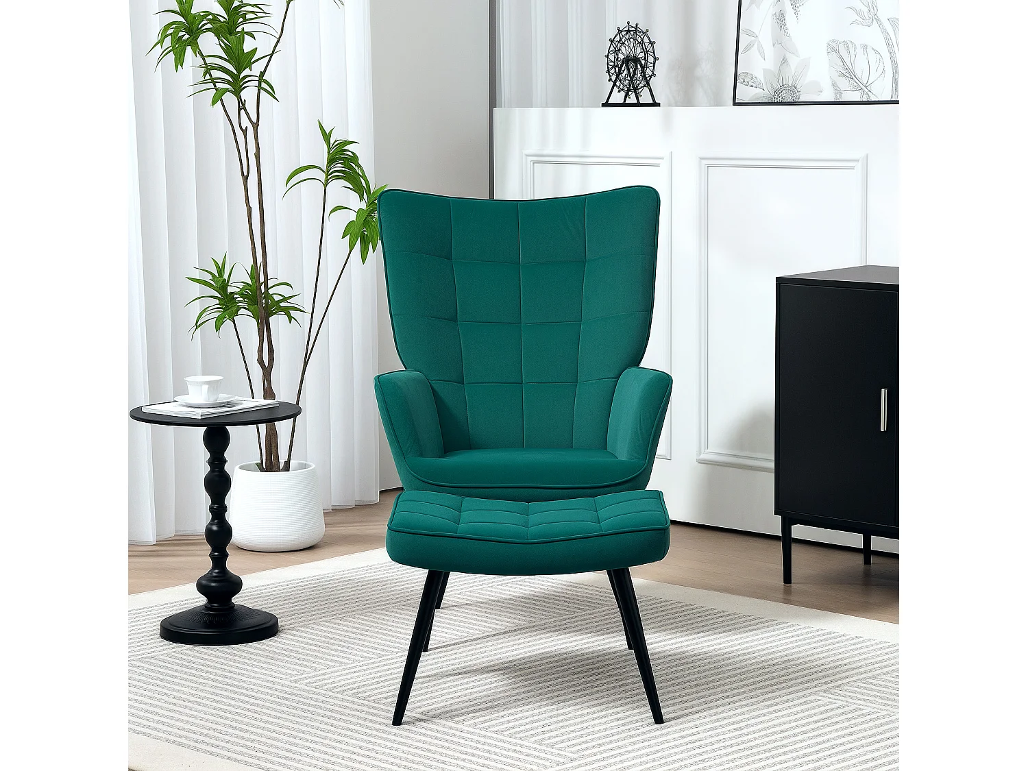 Fauteuil design néo-rétro haut dossier effet capitonné à oreilles - repose-pied inclus - piètement effilé acier noir tissu aspect velours vert emeraude