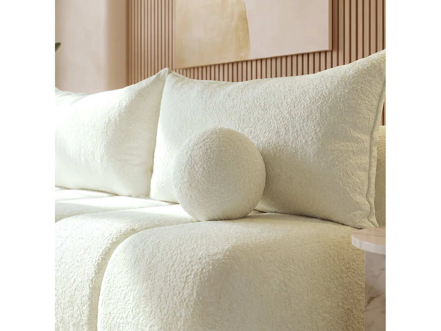 BESILIO Canapé arrondi convertible Glomi – tissu bouclé, canapé avec fonction lit – Crème