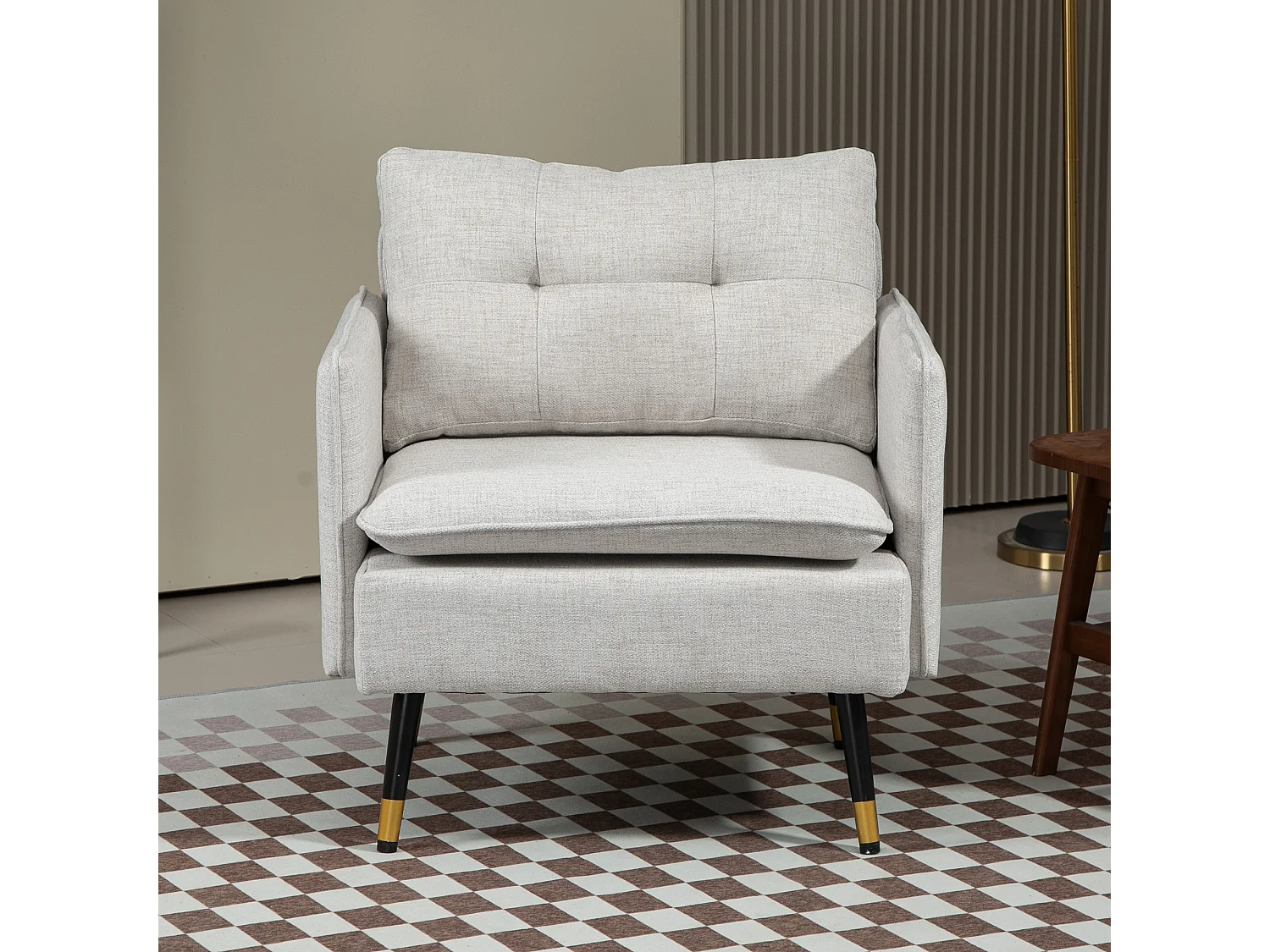 Fauteuil style art-déco dossier effet capitonné piètement incliné effilé métal noir extrémités dorées tissu blanc cassé