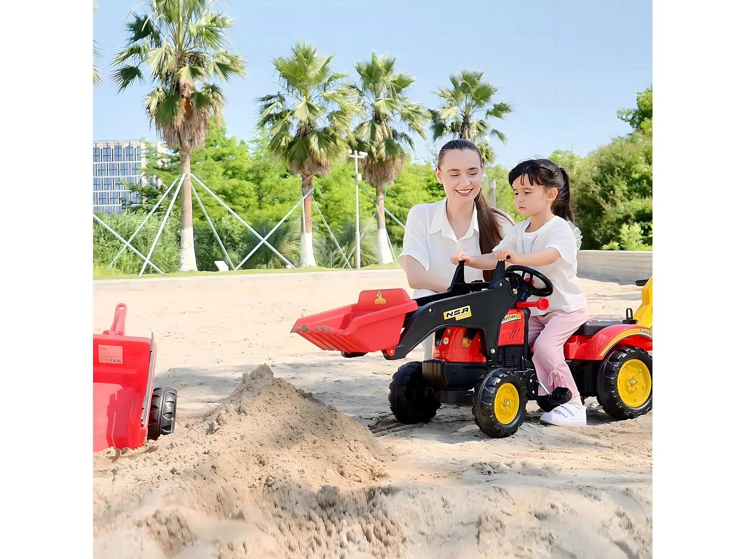 Ruspa giocattolo a pedali con pale e volante multicolore