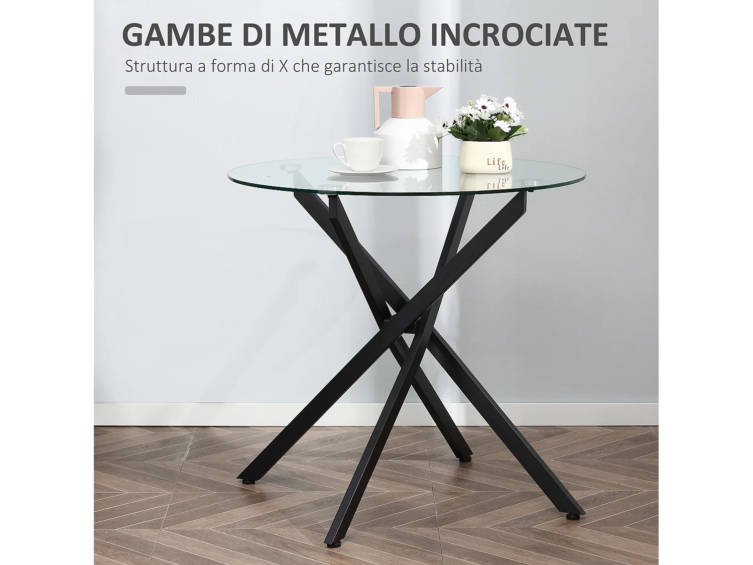 Tavolo da pranzo rotondo in vetro e gambe incrociate in metallo