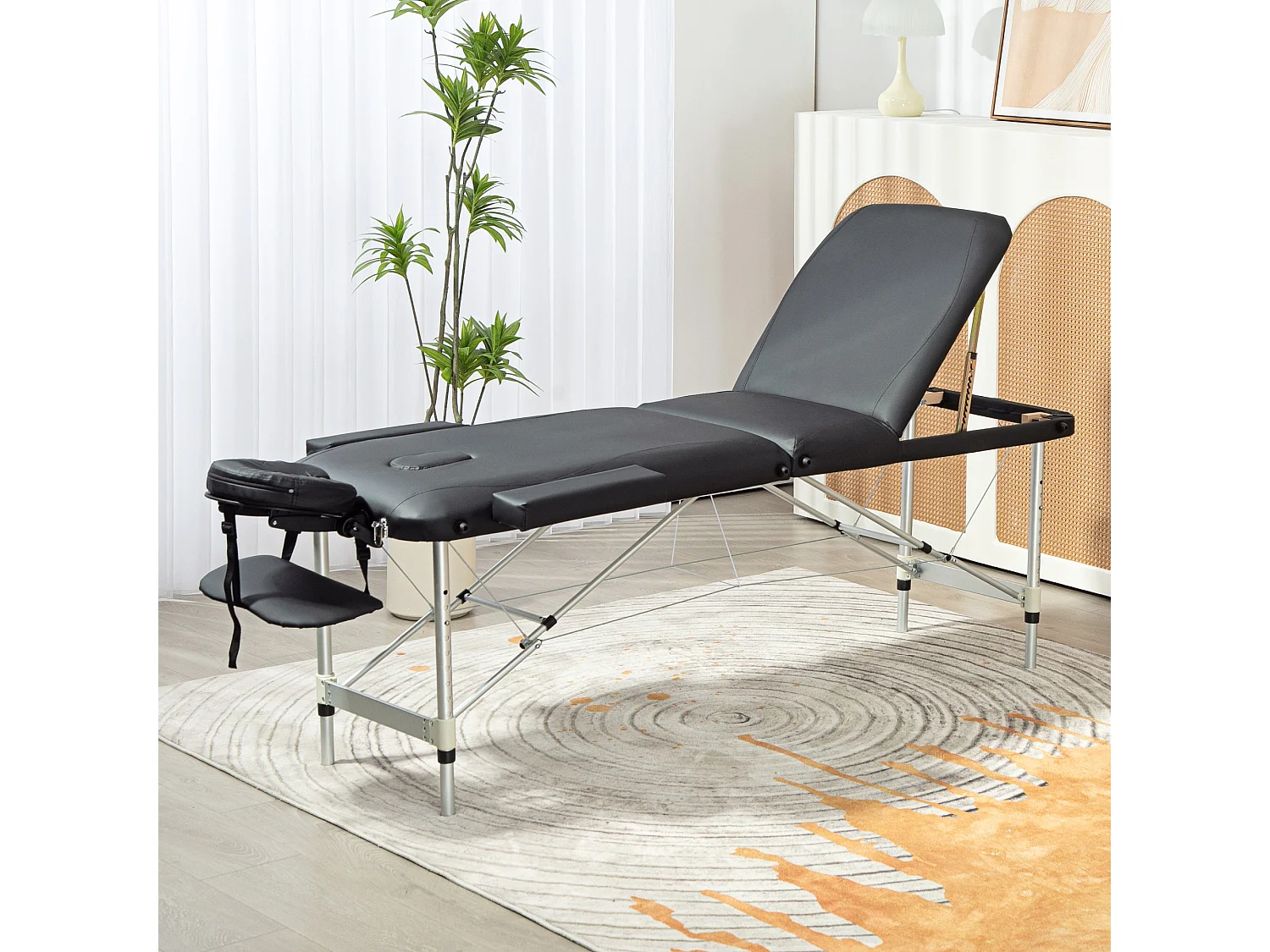 Lettino da massaggio pieghevole ad altezza regolabile nero