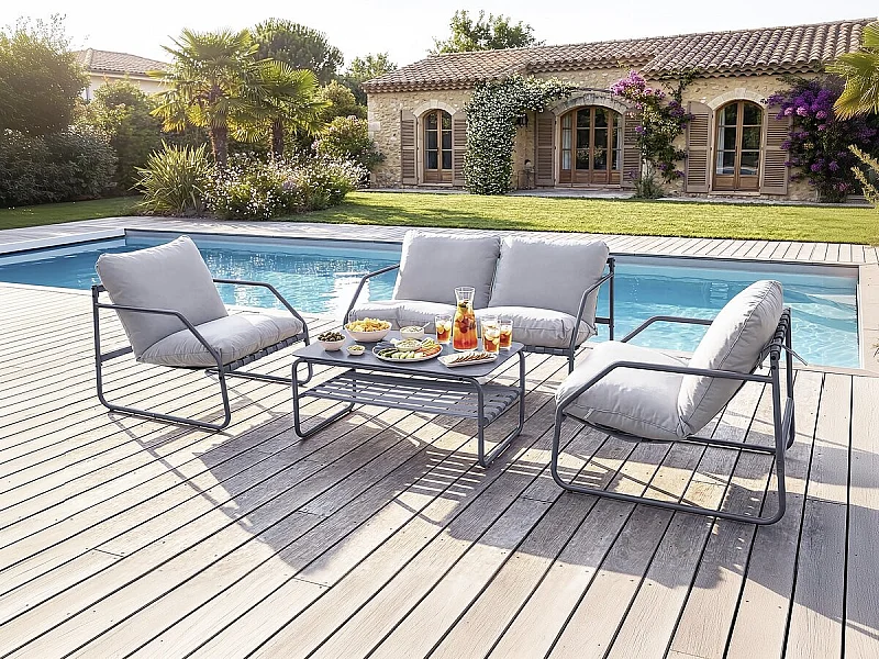 Salotto da giardino 4 posti "Sora" in metallo grigio con cuscini spessi e tavolino in vetro