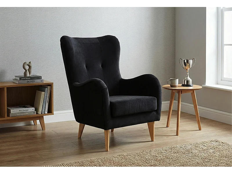 Élégant fauteuil de détente avec assise et dossier profilés.