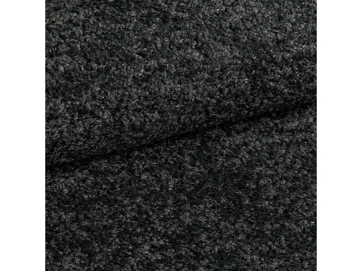 Élégant fauteuil Roland de détente avec assise et dossier profilés.