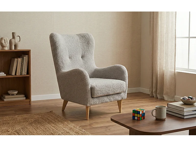 Élégant fauteuil Roland de détente avec assise et dossier profilés.