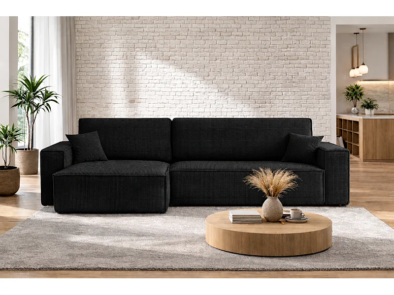 Divano angolare trasformabile reversibile CARLOS XL – Velluto a coste nero, ampio vano contenitore, funzione letto, montaggio universale