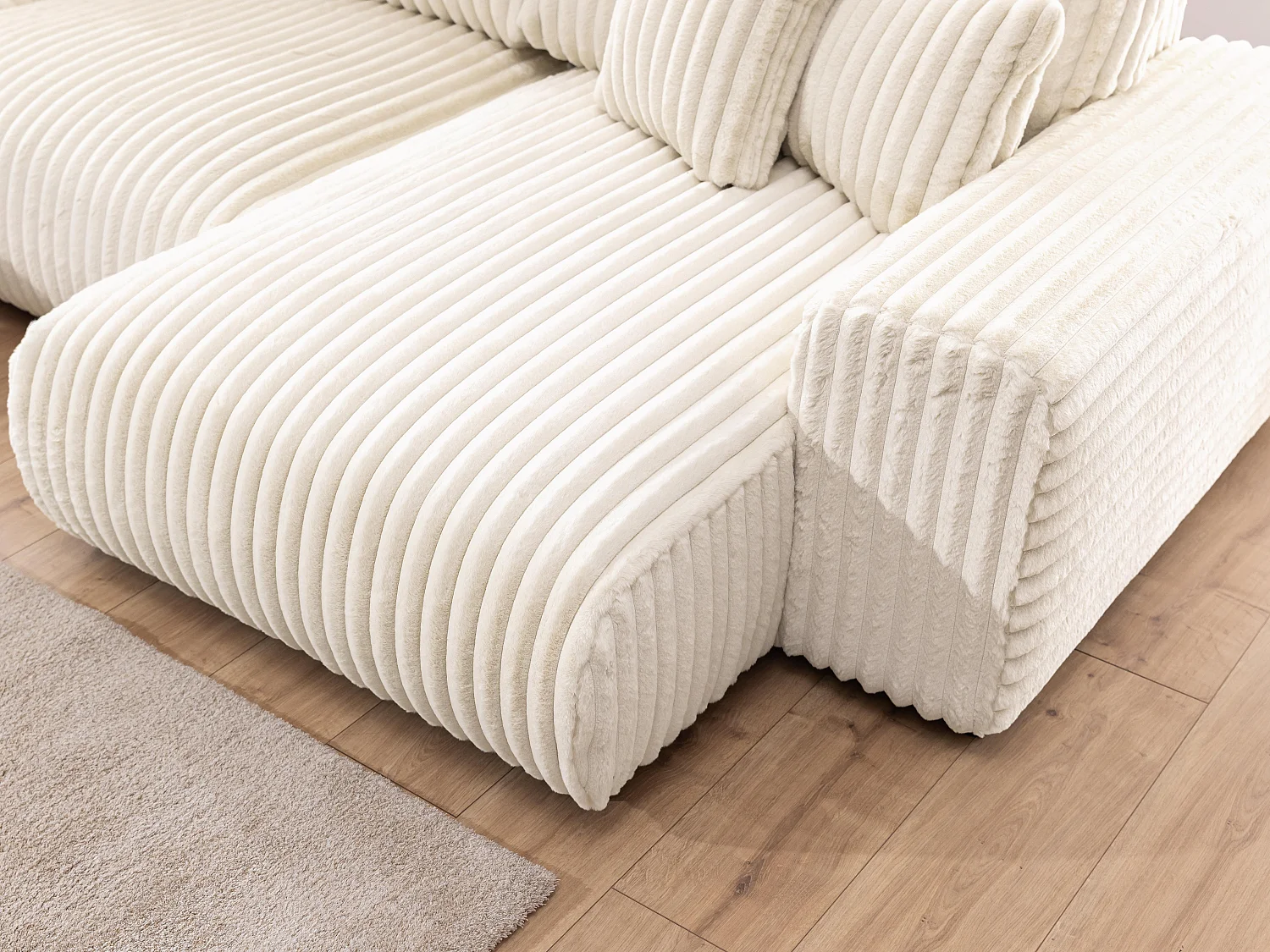 Canapé panoramique XXL avec fonction couchage et coffre de rangement en velours côtelé pelucheux beige clair MOLLIS