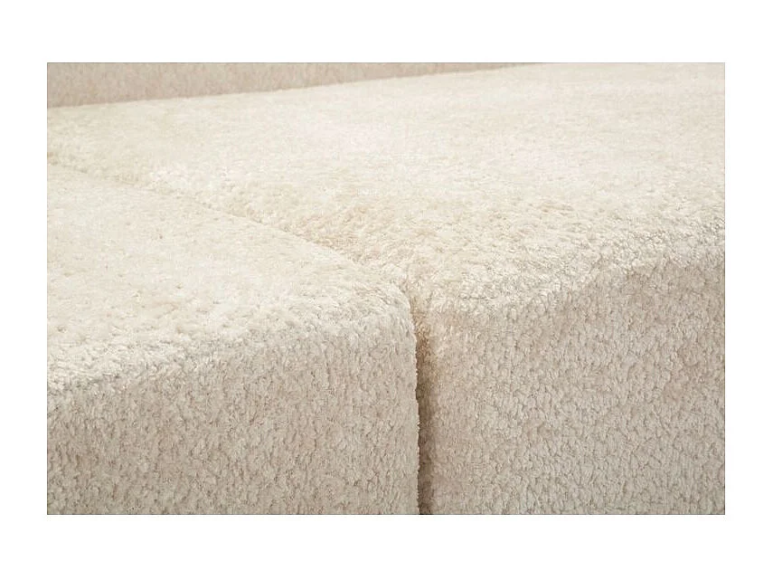 Sofá moderno de diseño escultural en color blanco.