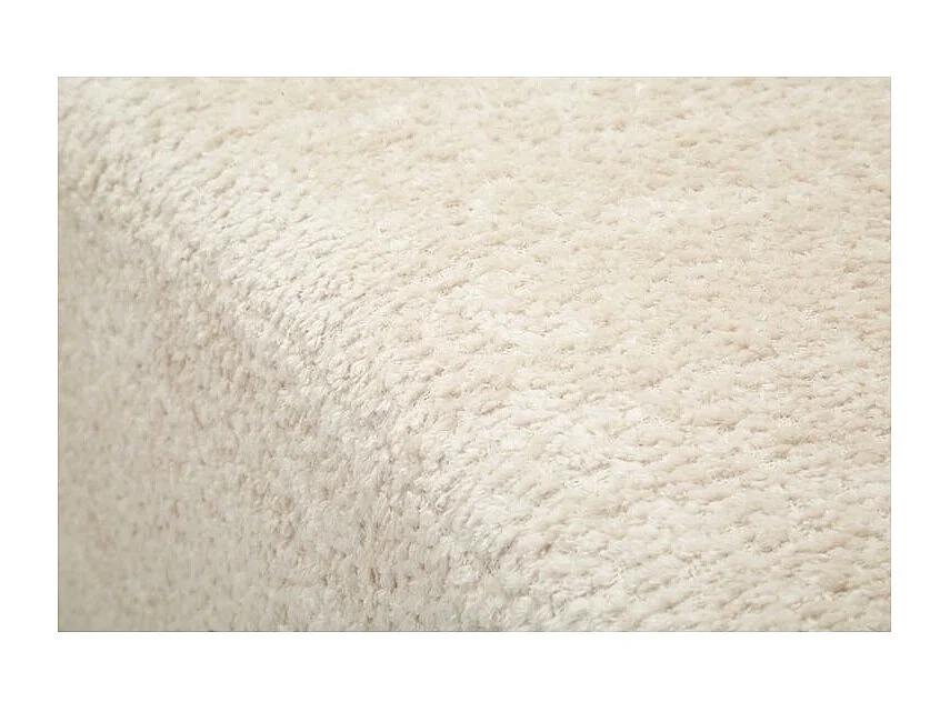 Sofá moderno de diseño escultural en color blanco.