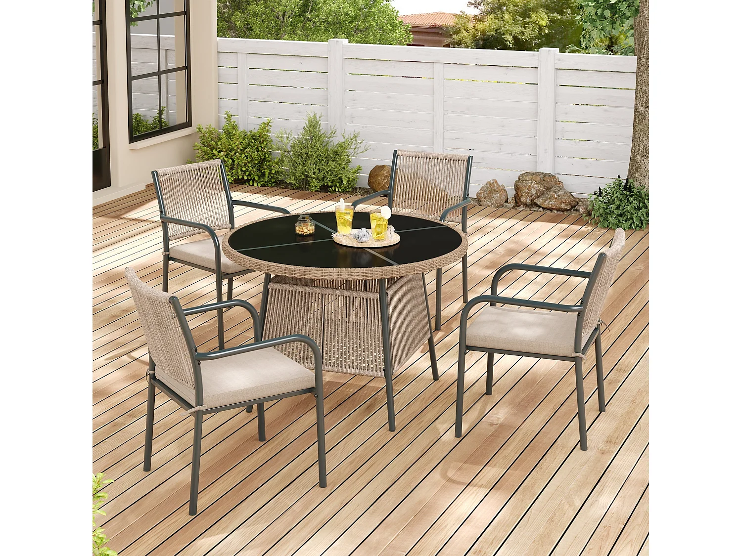 Salle à Manger de Jardin 5 Pièces – Table Ronde Verre Trempé + 4 Fauteuils – Structure Fer – Rotin PE – Coussins Inclus