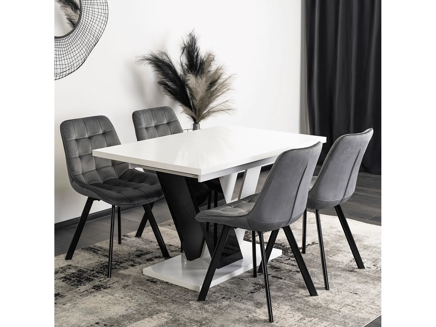 Table extensible CLARK aux dimensions 120-160 cm en blanc avec pieds en noir brillant