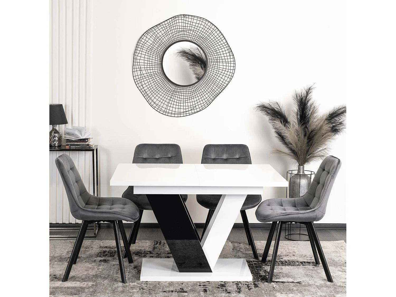 Table extensible CLARK aux dimensions 120-160 cm en blanc avec pieds en noir brillant