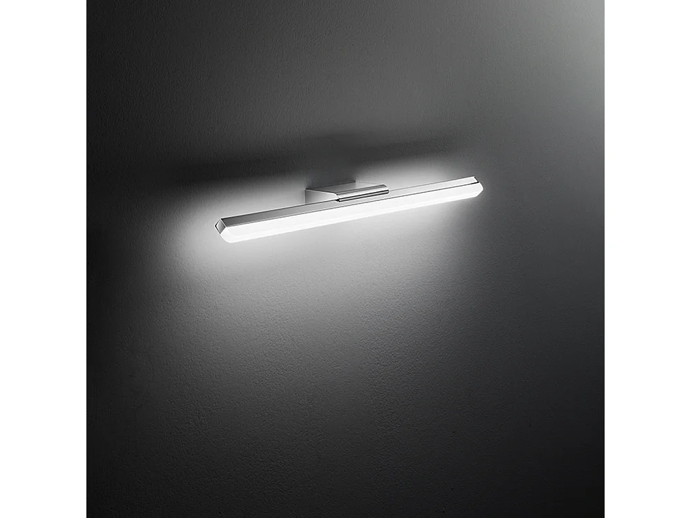 Aplique LED de pared Perenz serie 10S46331 en metal cromado pulido y acrílico, luz cálida de 3000K, 20W, diseño moderno y lineal.