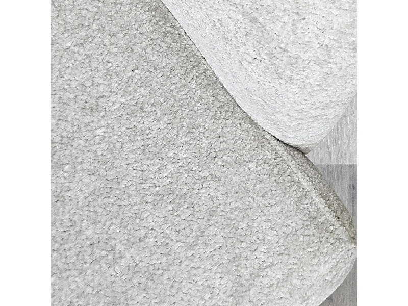 Fauteuil rotatif 360° en tissu doux écru avec repose-pied - EVA